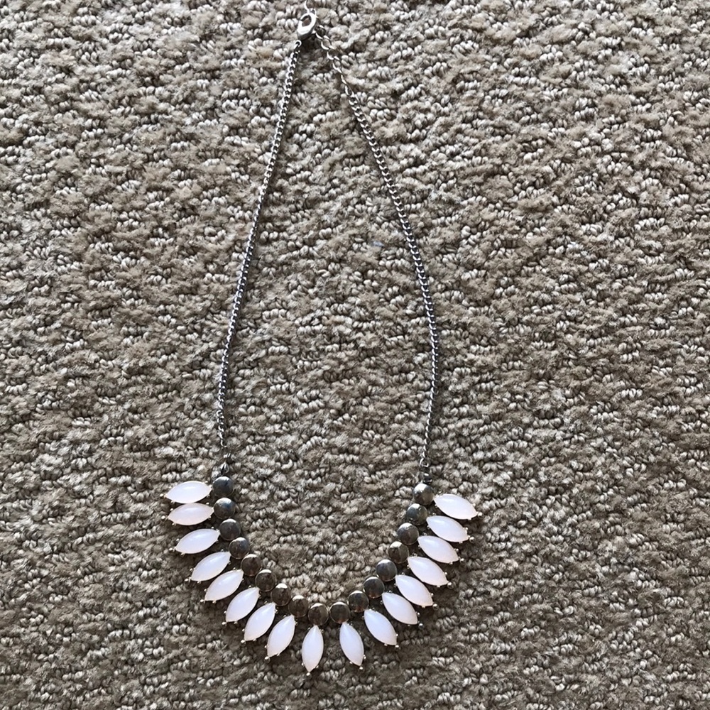 Necklace with light pink stones and gold accent.